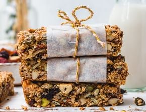 A stack of super seed and fruit granola bars by Nature's Heart