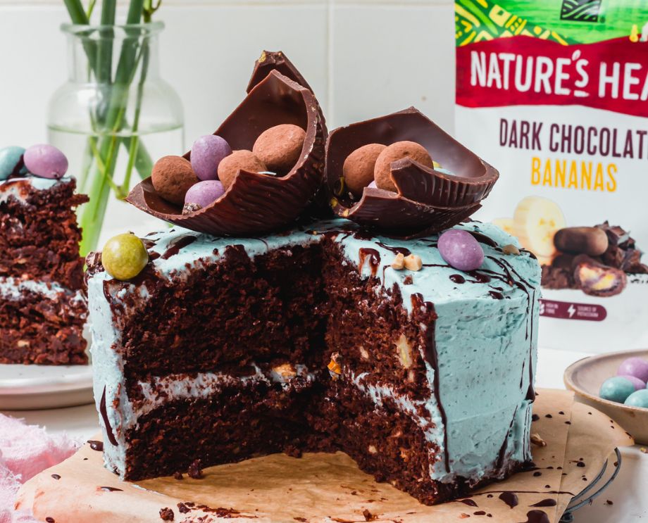 Chocolate Banana Cake with a large slice cut out of it. 