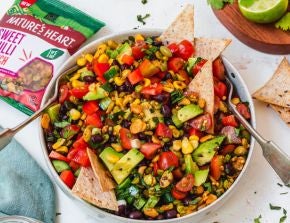 A bowl of salsa with tortilla chips