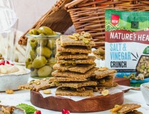 A stack of crackers made using Nature's Heart Salt & Vinegar Crunch