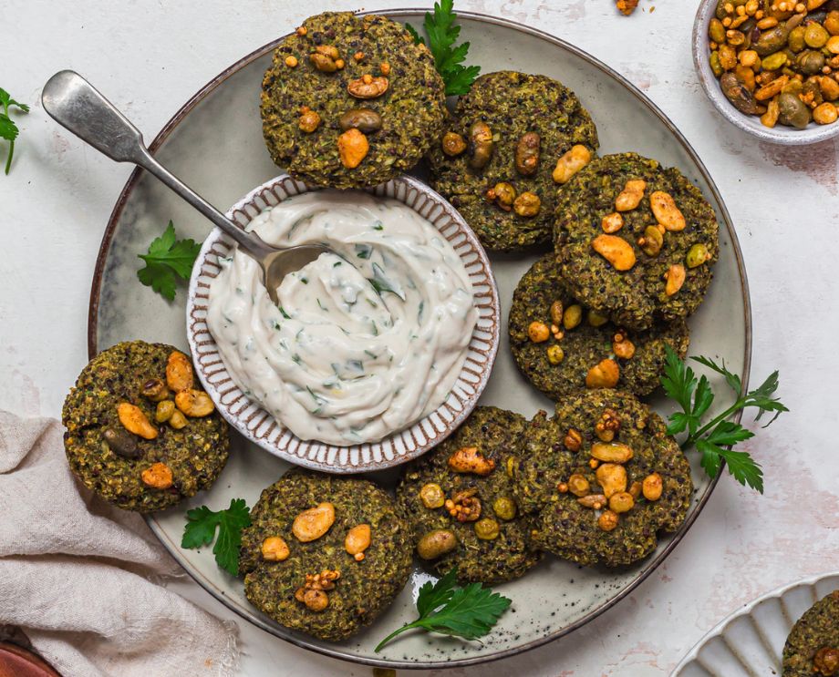 A plate of broccoli bites with a creamy dip