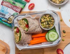 Lunchbox with Chuna Crunch Wraps, carrot sticks, cucumber slices and a container of crunch